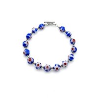 two tone blue with white flower and red centre accent