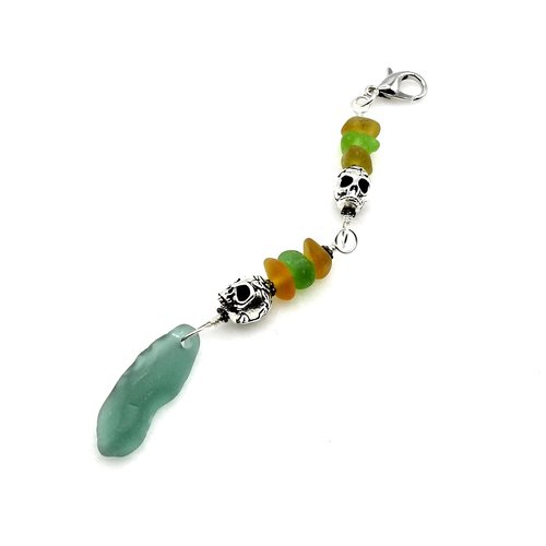 two silver skulls with multi colour beach glass