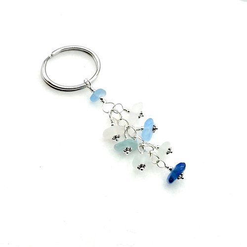 white and blue key chain